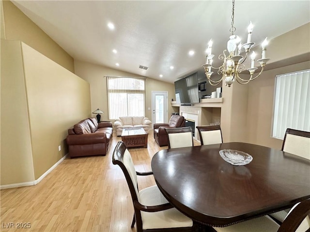 4484 Warbonnet Way, Las Vegas, NV 89147 - dining space featuring recessed lighting, vaulted ceiling, an inviting chandelier, baseboards, and light wood-style floors
