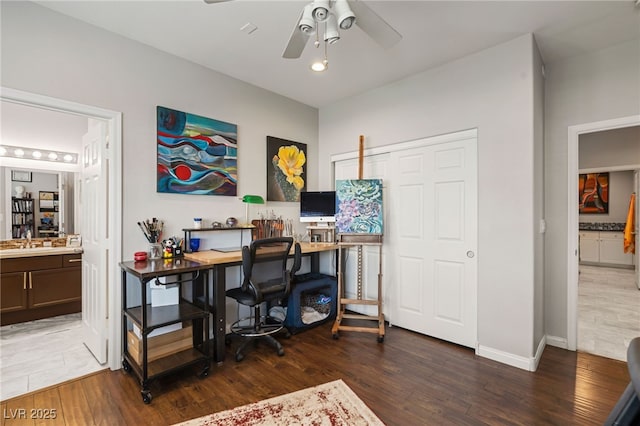 home office featuring baseboards, wood finished floors, and ceiling fan