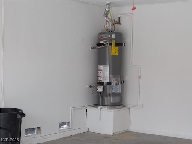 utility room featuring water heater