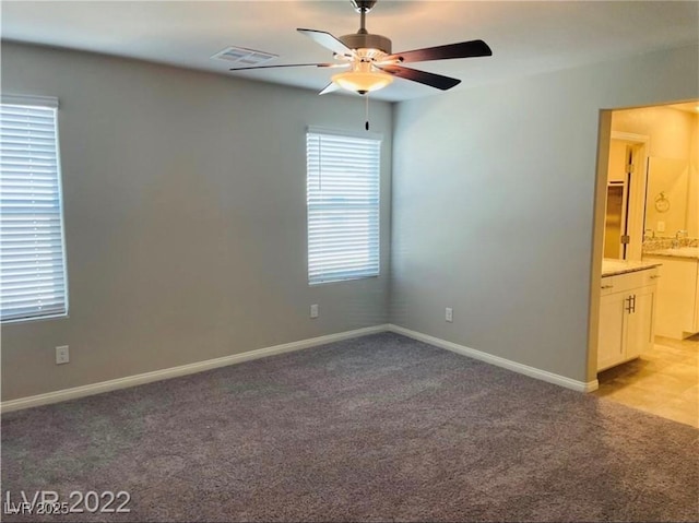 7892 W Shelbourne Ave, Las Vegas, NV 89113 - empty room with light carpet, a ceiling fan, visible vents, and baseboards