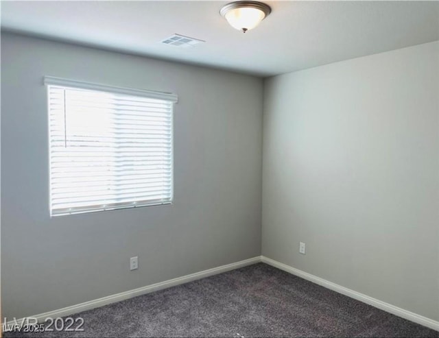 7892 W Shelbourne Ave, Las Vegas, NV 89113 - unfurnished room featuring baseboards, visible vents, and dark carpet