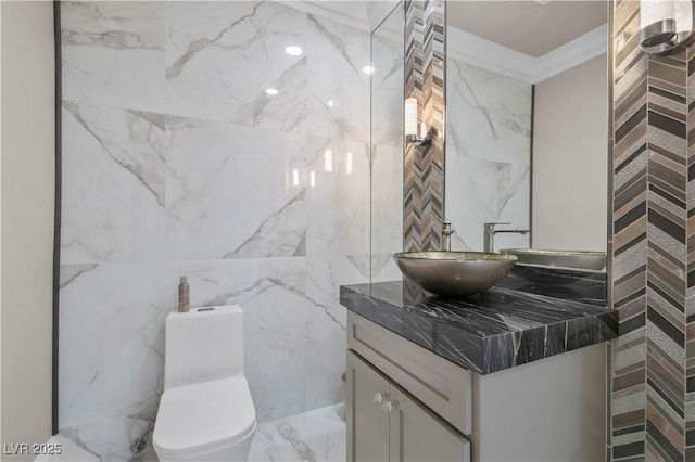 2715 Twin Palms Cir, Las Vegas, NV 89117 - bathroom featuring vanity, tile walls, marble tiled floors, and ornamental molding