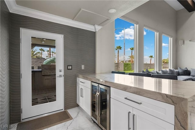 2715 Twin Palms Cir, Las Vegas, NV 89117 - bar area featuring beverage cooler and light marble finish floors