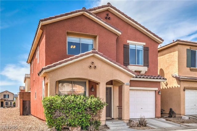 5593 Gold Mint Ln, Las Vegas, NV 89122 - mediterranean / spanish-style house featuring an attached garage, a tile roof, and stucco siding