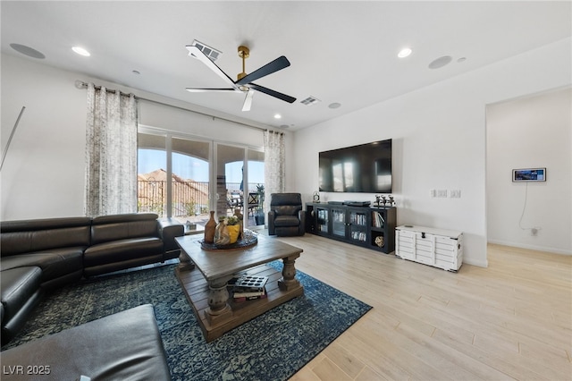 living area with ceiling fan, recessed lighting, wood finished floors, and visible vents