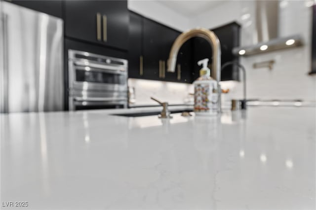 12 Tatahatso Point St, Henderson, NV 89011 - kitchen view of dark cabinetry and stainless steel appliances