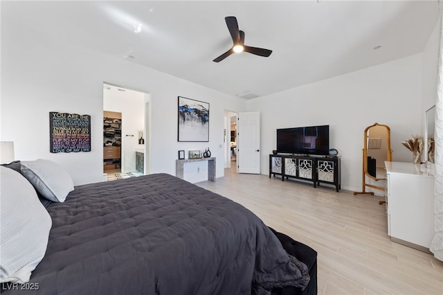 12 Tatahatso Point St, Henderson, NV 89011 - bedroom featuring light wood finished floors, ceiling fan, baseboards, and connected bathroom