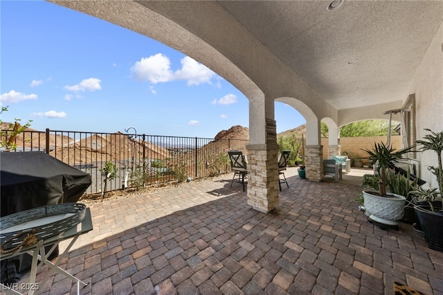 12 Tatahatso Point St, Henderson, NV 89011 - fenced backyard with a patio and outdoor dining area