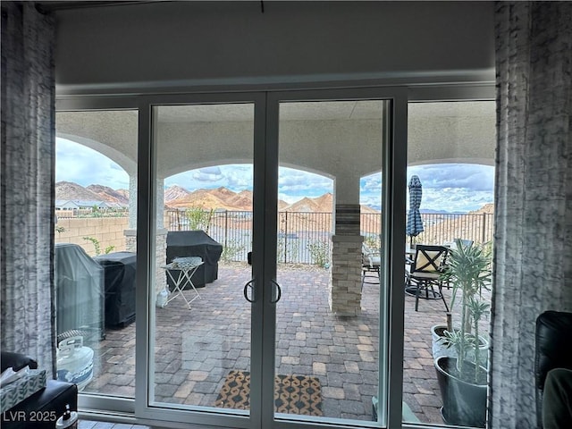 entryway featuring a wealth of natural light and french doors