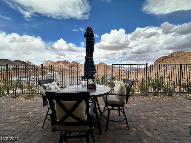 view of patio / terrace featuring fence and outdoor dining area