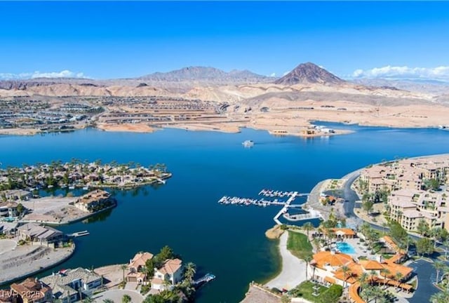 aerial view featuring a water and mountain view