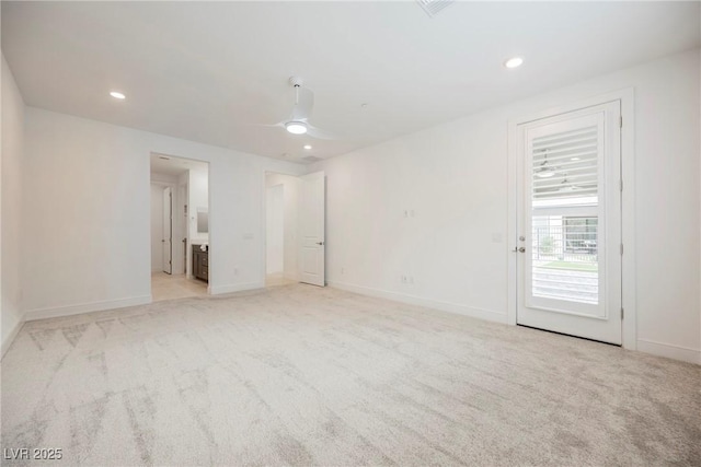empty room featuring recessed lighting, light carpet, a ceiling fan, and baseboards