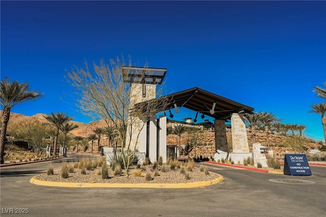 exterior space featuring a mountain view and curbs