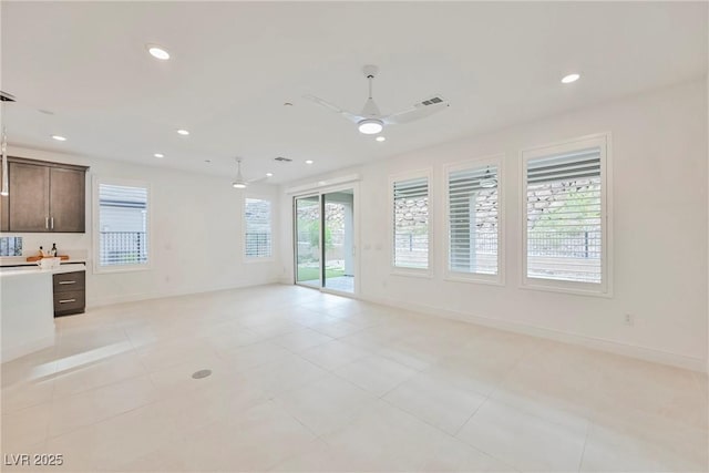 unfurnished living room featuring baseboards, recessed lighting, a ceiling fan, and light tile patterned floors