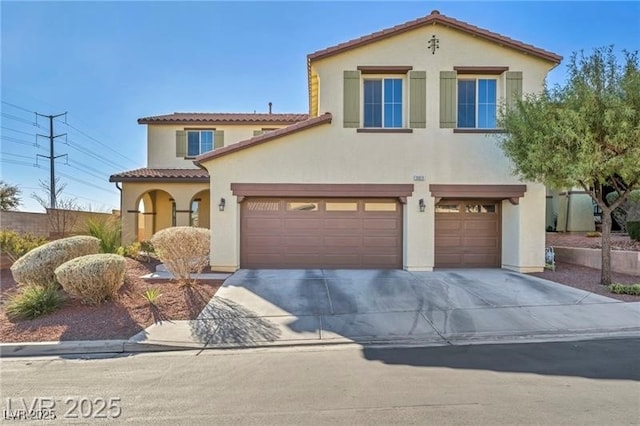 10611 Auburn Springs Ave, Las Vegas, NV 89166 - mediterranean / spanish house with an attached garage, driveway, a tiled roof, and stucco siding