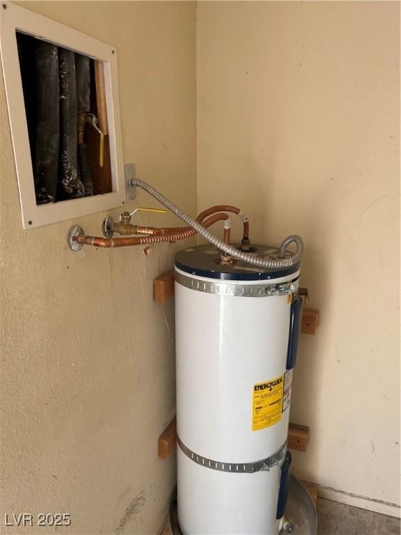 utility room with water heater