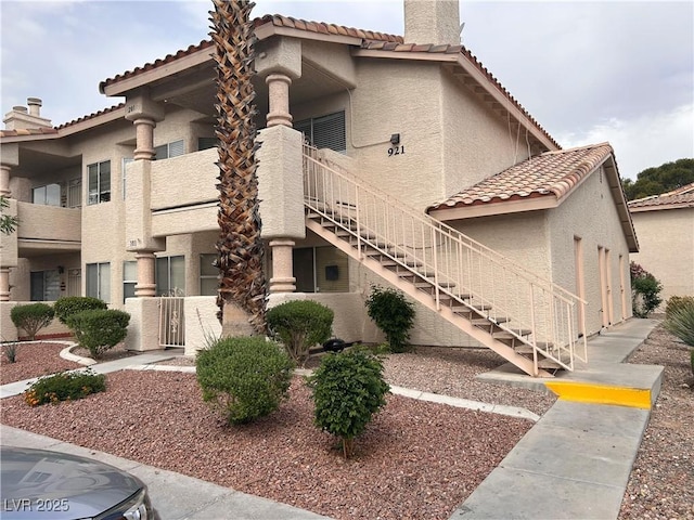 view of building exterior with stairway