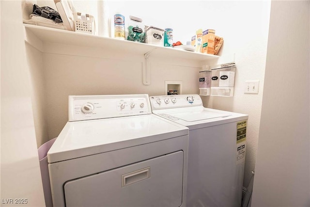 laundry area with washing machine and clothes dryer and laundry area