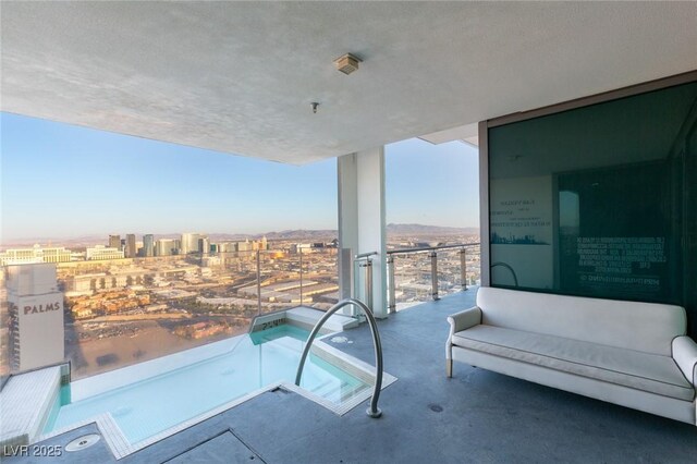 balcony featuring a city view