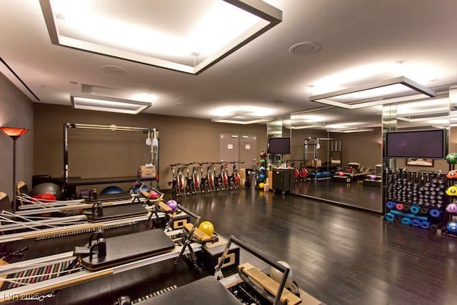 gym with wood finished floors