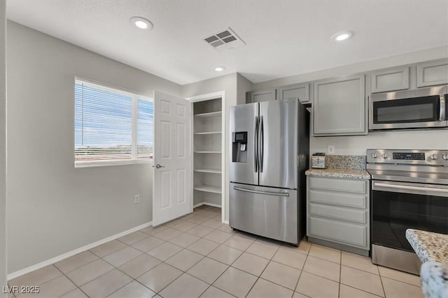 kitchen with visible vents, recessed lighting, appliances with stainless steel finishes, gray cabinets, and light tile patterned floors