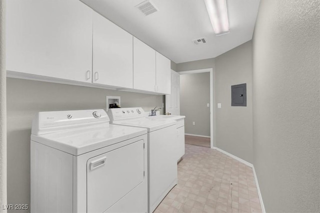 clothes washing area featuring separate washer and dryer, baseboards, cabinet space, and visible vents