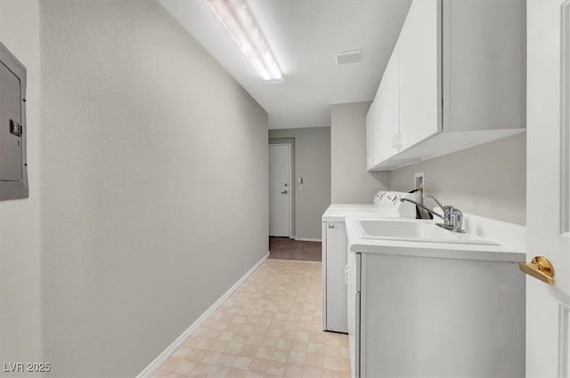 washroom featuring light floors, visible vents, independent washer and dryer, baseboards, and cabinet space