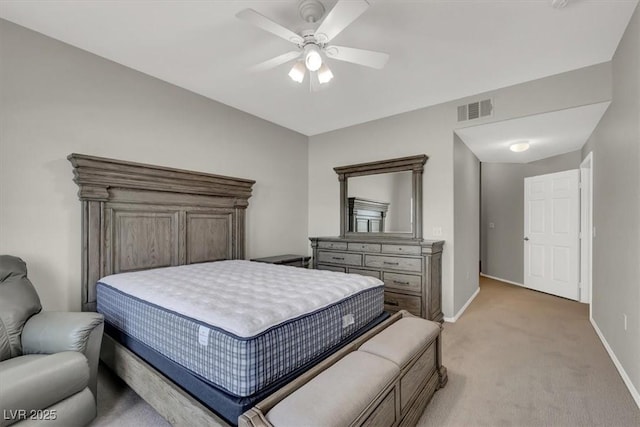 bedroom featuring ceiling fan, light carpet, visible vents, and baseboards