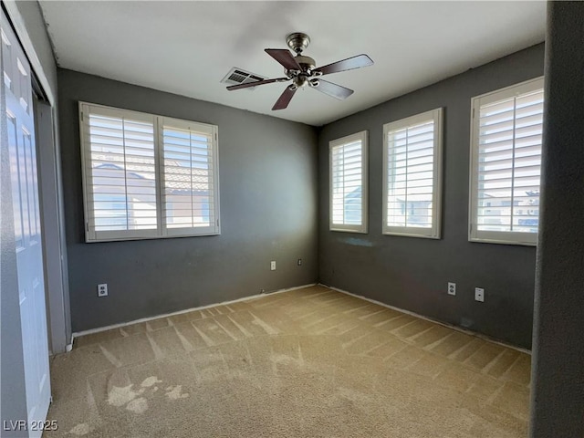 7173 Dravite Ct, Las Vegas, NV 89148 - unfurnished room with light carpet, a ceiling fan, and baseboards