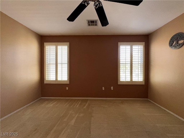 7173 Dravite Ct, Las Vegas, NV 89148 - spare room with a ceiling fan, light colored carpet, and baseboards