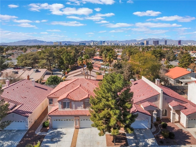 aerial view featuring a mountain view and a residential view