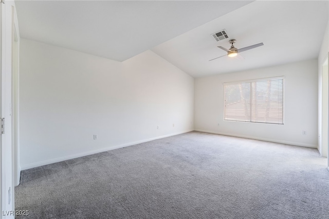empty room with carpet, visible vents, a ceiling fan, and baseboards
