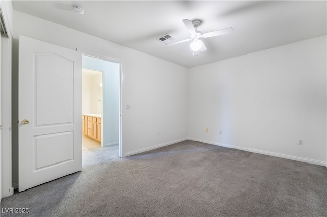 unfurnished room with baseboards, visible vents, light colored carpet, and ceiling fan