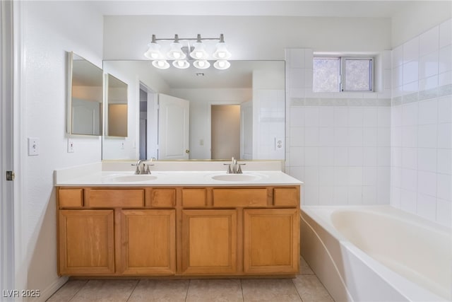 bathroom featuring tile patterned floors, a sink, and double vanity