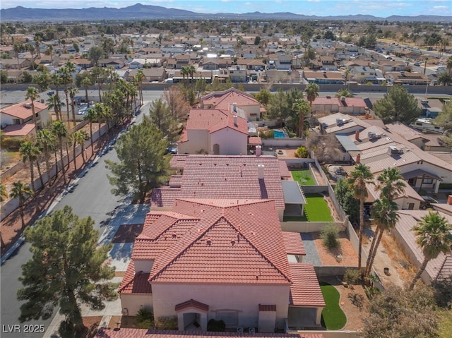 drone / aerial view featuring a residential view and a mountain view