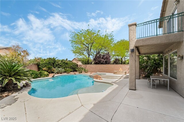 view of pool featuring a patio area, a fenced in pool, a fenced backyard, and an in ground hot tub