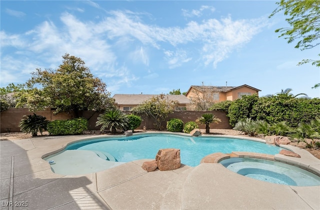 view of swimming pool featuring a fenced backyard, a patio area, and a pool with connected hot tub