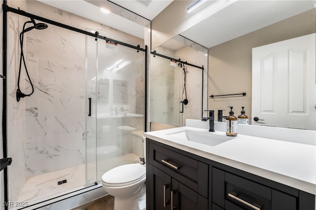 full bathroom featuring a baseboard heating unit, vanity, a marble finish shower, and toilet