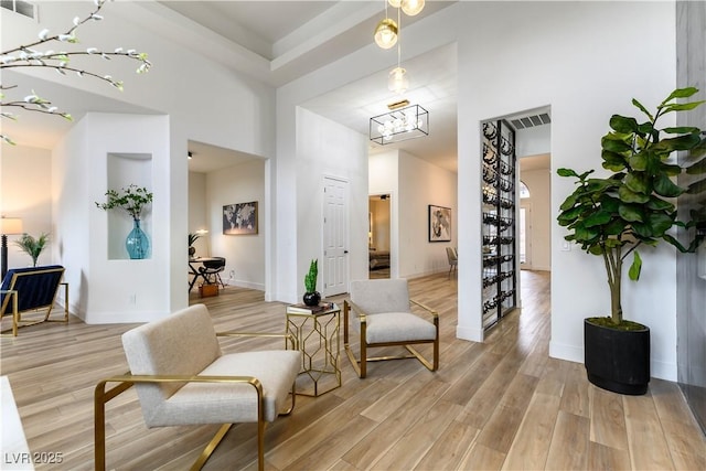 1350 Rossini St, Henderson, NV 89052 - sitting room with a towering ceiling, light wood finished floors, and baseboards