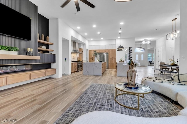 1350 Rossini St, Henderson, NV 89052 - living area with ceiling fan, light wood-style floors, recessed lighting, and baseboards