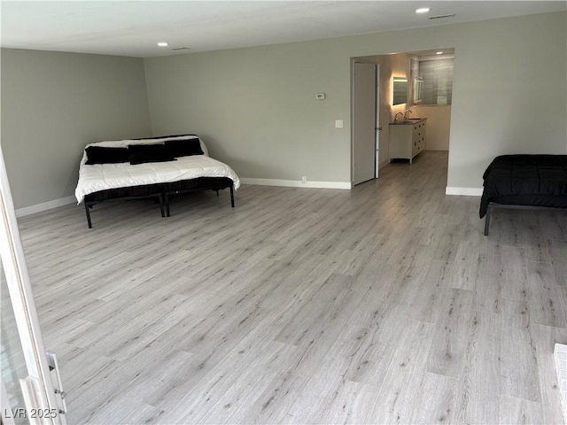 bedroom with visible vents, baseboards, recessed lighting, and light wood-style floors