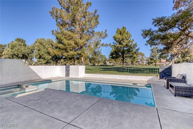 view of swimming pool featuring a patio area, a fenced in pool, and a fenced backyard