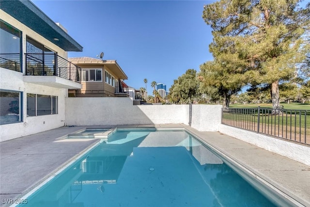 view of swimming pool with a fenced backyard, a patio, and a pool with connected hot tub