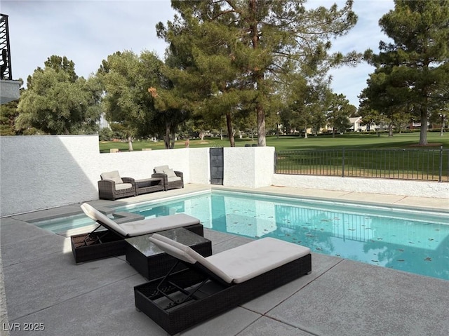 view of swimming pool featuring an outdoor hangout area, a fenced in pool, a patio area, and fence