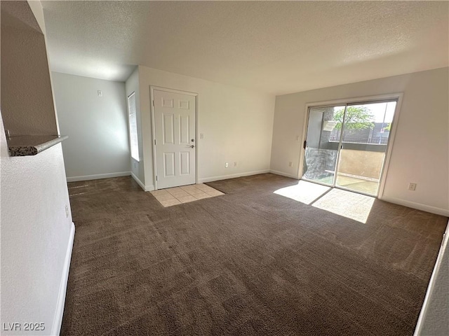 5055 W Hacienda Ave Unit 1095, Las Vegas, NV 89118 - unfurnished room featuring carpet floors, a textured ceiling, and baseboards