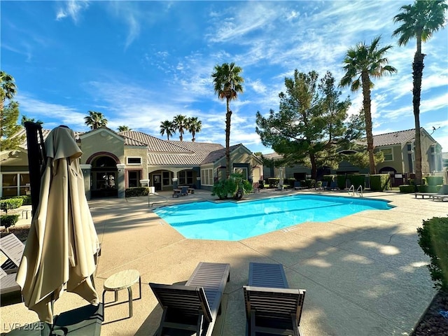 5055 W Hacienda Ave Unit 1095, Las Vegas, NV 89118 - community pool featuring a patio area