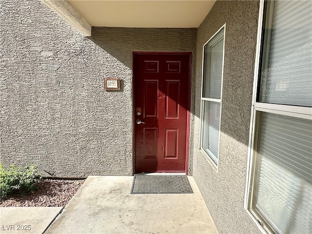 5055 W Hacienda Ave Unit 1095, Las Vegas, NV 89118 - doorway to property featuring stucco siding