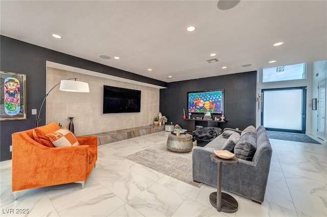 living area with visible vents, recessed lighting, and marble finish floor