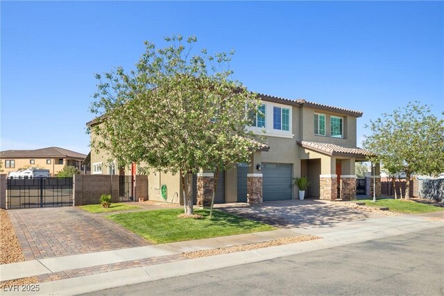 1512 Sagefield Way, Logandale, NV 89021 - view of front of house featuring stucco siding, driveway, a gate, an attached garage, and stone siding