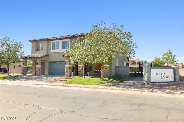 1512 Sagefield Way, Logandale, NV 89021 - view of front of home featuring stucco siding, concrete driveway, a tiled roof, and a garage